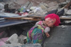 Toys buried in the rubble of destroyed buildings after an earthquake in Afrin District, Aleppo Governorate, northwest Syria