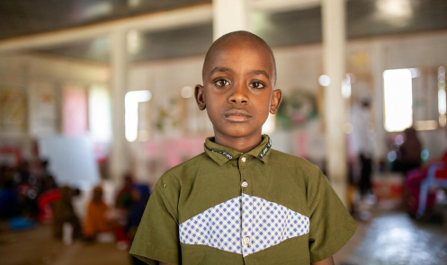 A portrait of Omar, 7, at the Child-Friendly Space he loves to attend
