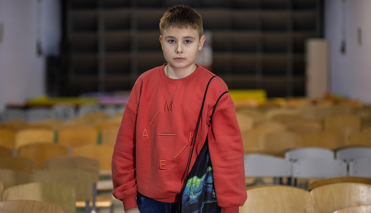 Roman with his grab bag in his school shelter in Kyiv